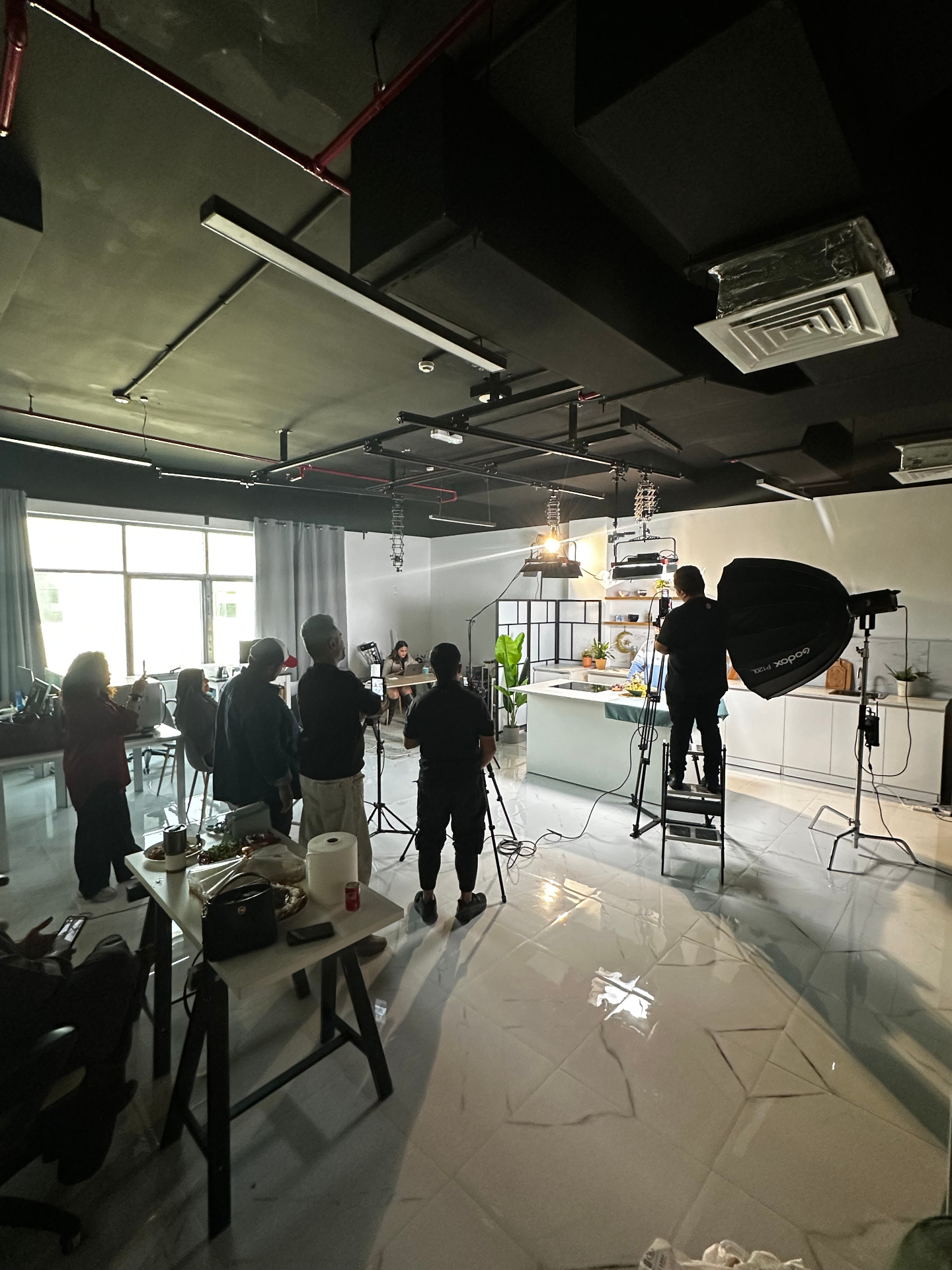 Lighting rail above the studio kitchen island