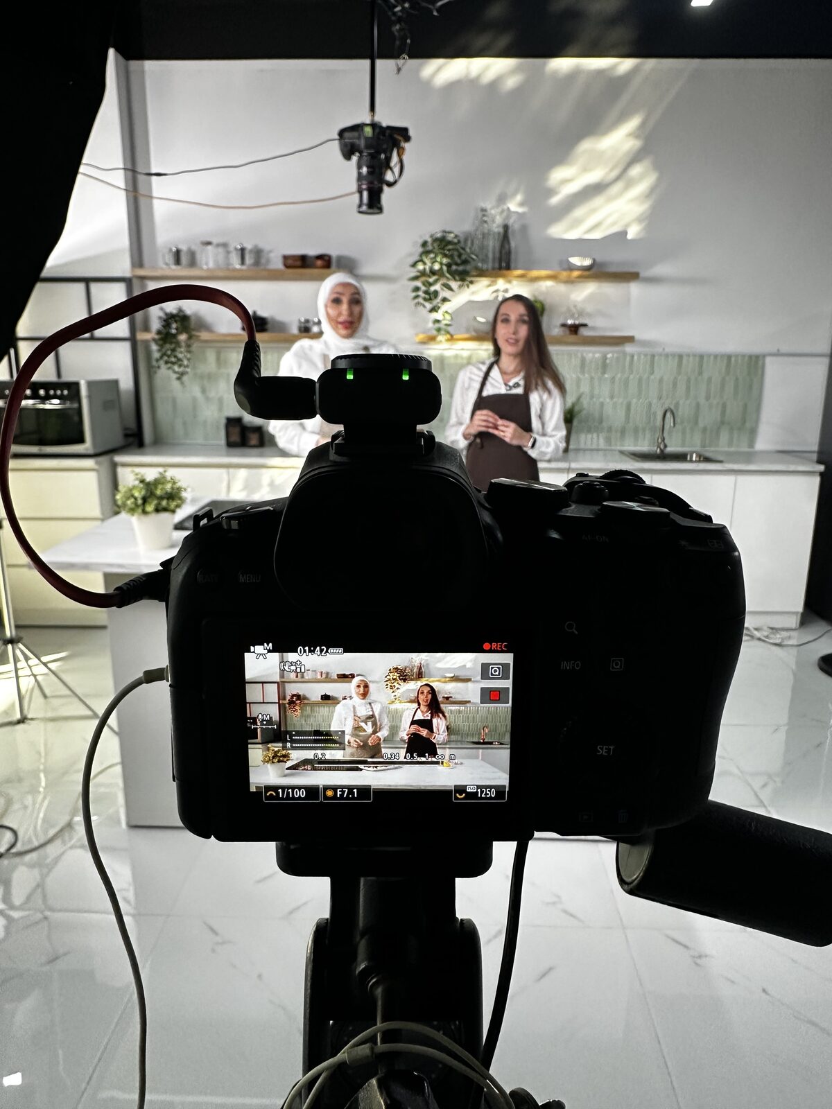 Chef cooking on a wooden board with camera in soft focus